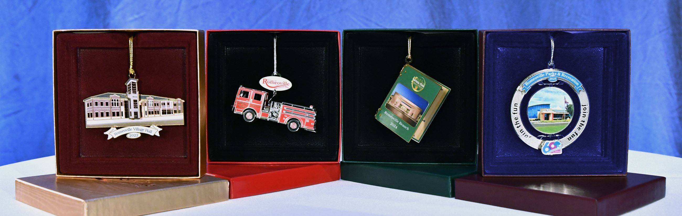 Four ornaments in their boxes.