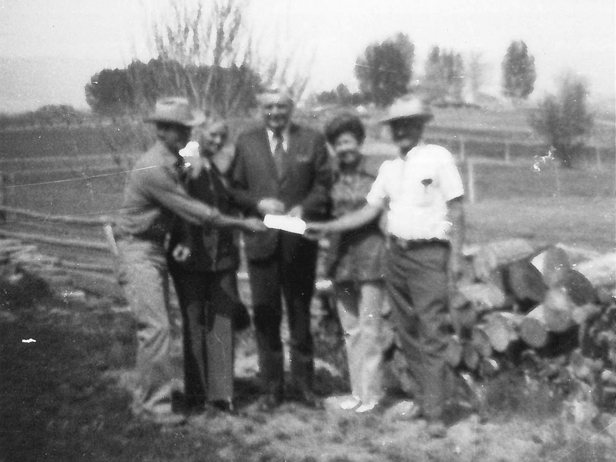 Mayor O'Hara presents a check to the Alexanders for the purchase of 68 acres of woodlands.
